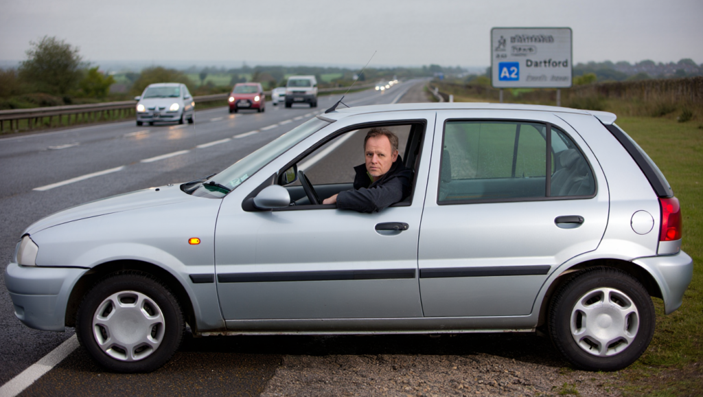 Broken-down car with hazard lights on near the A2 in Dartford.