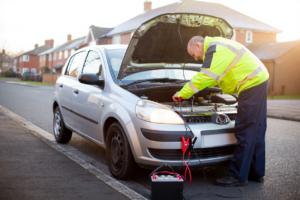 Jump start service assisting a car with a flat battery in Kent.