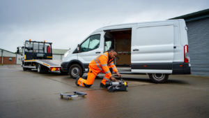 Non-runner van being prepared for transport in an industrial estate.