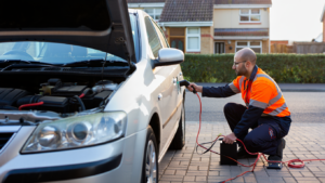 Jump start service assisting a modern car with sensitive electronics.